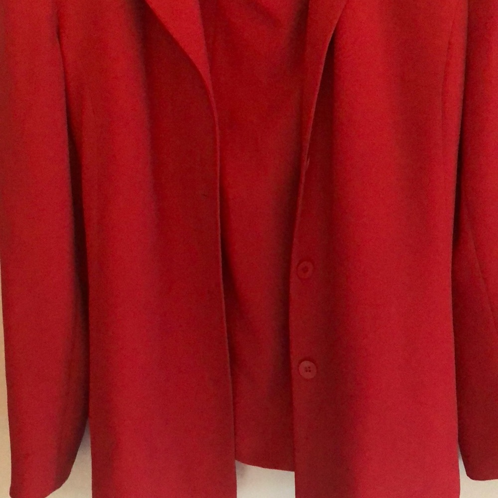 Pretty fully lined coral skirt suit.